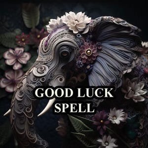May include: A close-up of a gray elephant sculpture with intricate paper designs and floral accents. The elephant's trunk is curled up and the sculpture is surrounded by flowers. The text "GOOD LUCK SPELL" is written in white letters on a black background.
