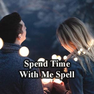 May include: A couple is standing close together in a dimly lit setting. The man is wearing a dark blue sweater and the woman is wearing a denim jacket. The text "Spend Time With Me Spell" is superimposed on the image.