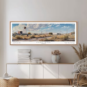 May include: A panoramic painting of a cityscape with a water tower, buildings, and power lines. The painting is framed in wood and has the text "MIDLAND TEXAS" and "Feel the Energy" at the bottom.