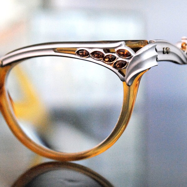 Funky Cats Eye Glasses by Bausch and Lomb Silver Aluminum and Amber Rhinestone Decorative Details