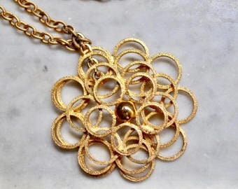 Gold Dangly Flower Pendant with Long Chain