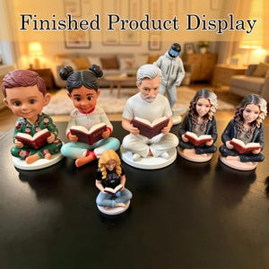 May include: A collection of figurines, each depicting a person reading a book. The figurines vary in appearance, with some wearing pajamas and others in casual attire. The text "Finished Product Display" is at the top of the image.