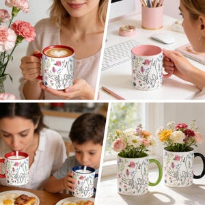 May include: White ceramic mug with a red interior and handle, featuring a floral design and a line drawing of hands holding each other. The mug has the word "Mom" on it.