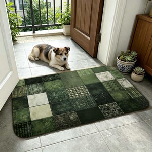 May include: A rectangular doormat with a patchwork design in shades of green and white. The mat is placed in front of a doorway, with a dog lying on the floor nearby. The mat's design includes various textures and patterns.