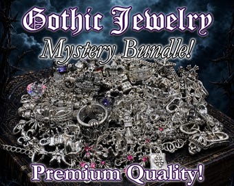 May include: A collection of silver-toned Gothic jewelry, including rings, necklaces, and pendants, is displayed on a dark, textured surface. The image features text that reads "Gothic Jewelry Mystery Bundle! Premium Quality!"