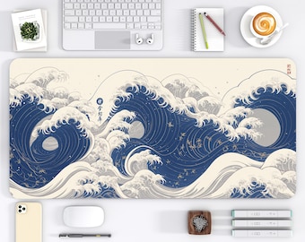 May include: A rectangular desk mat with a Japanese-inspired wave design in blue, white, and beige. The mat features Japanese text and a full moon. The desk mat measures approximately 40.6 x 81.3 cm.