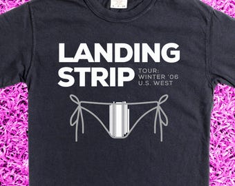 Coveted band merch from Landing Strip. Band name inspired by the phenomenon of the rectangular beaver. Pigment dyed concert Tee.