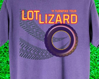 Band merch mockery from 3rd stage stalwarts 'Lot Lizard.' Pigment dyed concert t-shirt with a soft, vintage fade.