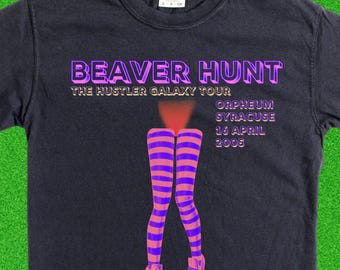 Comin' in bush-hot from the Hustler Galaxy. Faux band merch on a nicely weathered, garment dyed concert tee.