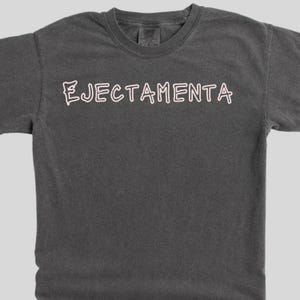 Zappa lyric tee. Ejectamenta arrives on a premium, garment dyed t-shirt with a soft, vintage fade.