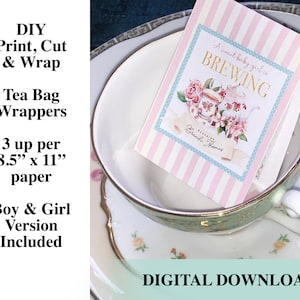 May include: Printable tea bag wrappers with a pink and blue striped background and a teacup illustration. The text reads "A sweet baby girl is brewing".  The wrappers are 8.5 inches by 11 inches and include boy and girl versions. Digital download.