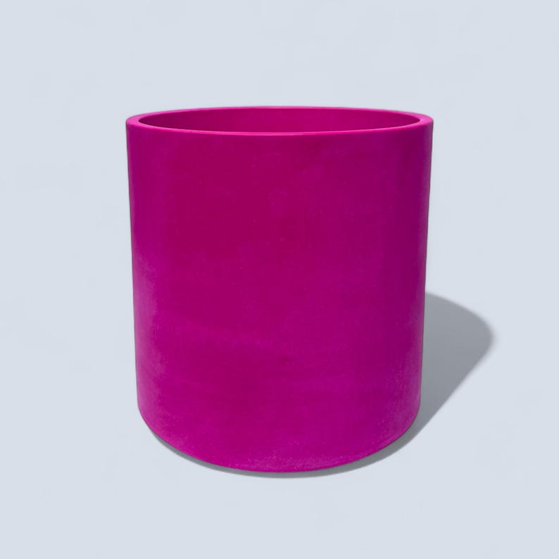 Large fuchsia round plant pot measuring 23 cm width and 22 cm height, shown on a pale grey background with a smooth cylindrical shape and soft shadow to the right.