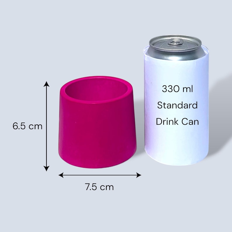 Small fuchsia tapered round plant pot with measurement arrows showing 6.5 cm height and 7.5 cm width, placed beside a standard 330 ml drinks can for size comparison on a pale grey background.