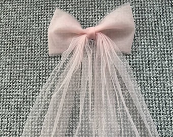Mini blush veil bow from soft  tulle attached to a hairpin