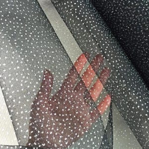 Sparkly fabric with small sparkles for sewing evening dresses, veils, skirts