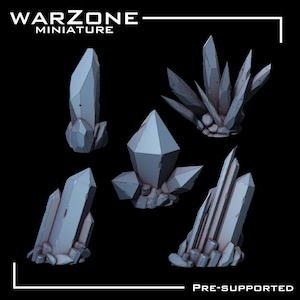 May include: Five gray crystal formations are displayed against a black background. The crystals vary in size and shape, with sharp, geometric facets. The text "WARZONE MINIATURE" is at the top left, and "PRE-SUPPORTED" is at the bottom right.