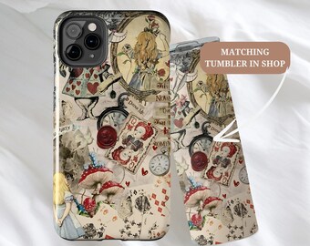 May include: A white iPhone case with a colorful Alice in Wonderland design. The case features images of Alice, the Cheshire Cat, playing cards, and other iconic elements from the story. The text "Drink Me" and "This Now" are visible on the case.  Matching tumbler in shop.