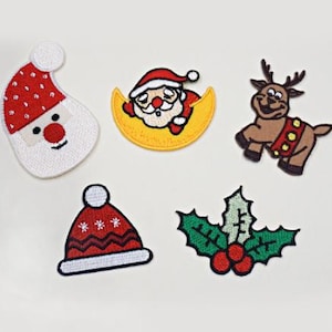 May include: Five embroidered iron-on patches with a Christmas theme. The patches include a Santa Claus, a reindeer, a Santa hat, a holly sprig, and a Santa Claus sleeping on a crescent moon.