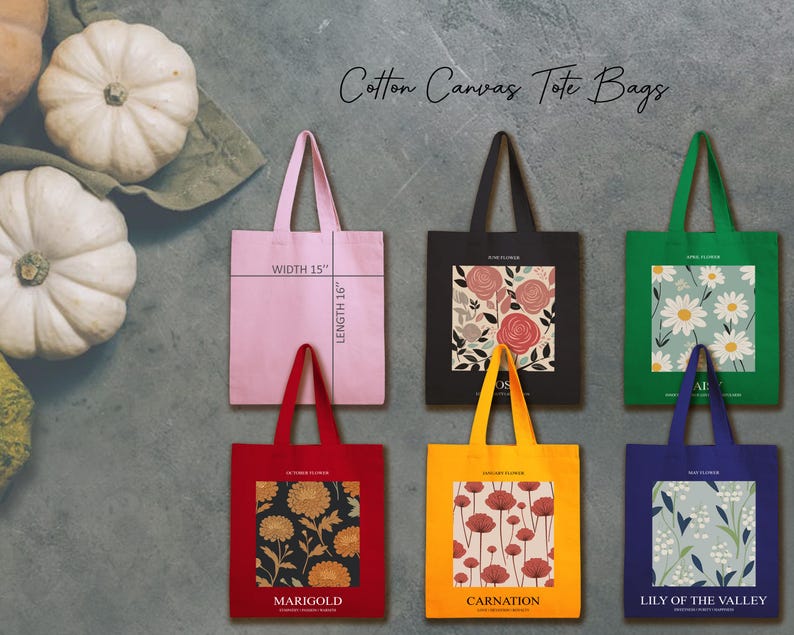 May include: A collection of cotton canvas tote bags in various colors, including pink, black, red, yellow, green, and blue. Each bag features a floral design or pattern. The pink bag is 15 inches wide and 16 inches long.