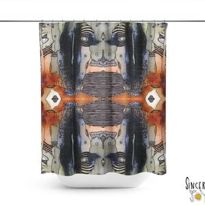 May include: A shower curtain with a colorful abstract design featuring a repeating pattern of faces and geometric shapes. The design is in shades of blue, orange, brown, and white.