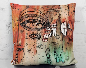 May include: A decorative pillow with a colorful abstract design featuring a large eye, geometric shapes, and a watercolor background. The pillow is made of a soft, beige fabric.