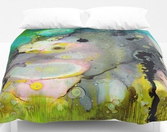 May include: Abstract art duvet cover with a green, blue, pink, and gray color scheme. The design features a large, abstract shape with a textured surface and a variety of smaller circles and shapes.