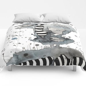 May include: A black and white duvet cover featuring a watercolour illustration of a stylised island with a striped pattern. The island is surrounded by a white background with small black and white details.