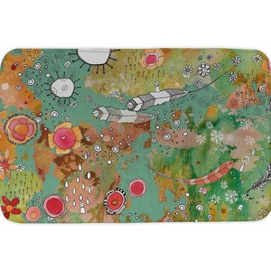 May include: A green, orange, and pink bath mat with a whimsical design featuring feathers, flowers, and swirls.