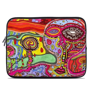May include: A colorful laptop sleeve with a psychedelic design featuring a large, abstract face with eyes, a mouth, and a nose. The background is a mix of red, orange, yellow, green, blue, and purple.