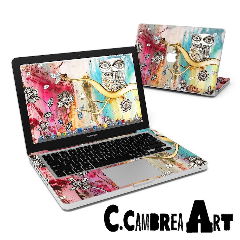 May include: A colorful laptop skin with an owl design. The skin features a watercolor background with splashes of pink, blue, and yellow. The owl is drawn in black and white and has a whimsical, cartoonish style. The skin is designed to fit a MacBook Pro.