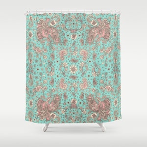 May include: A turquoise shower curtain with a pink and brown paisley pattern.