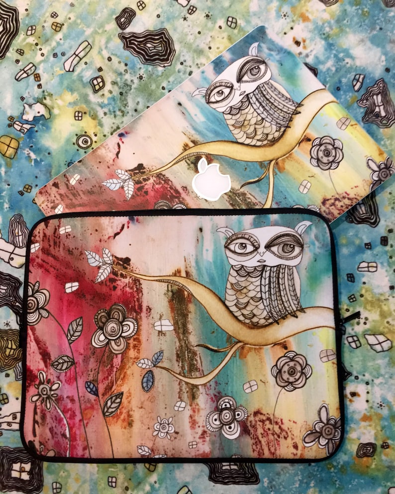 May include: Two laptop skins with an owl design. The top skin is a light blue background with a white owl on a branch. The bottom skin is a multi-colored background with a brown owl on a branch. Both skins feature a watercolor style with floral accents.