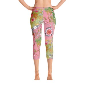 May include: Pink and green patterned leggings with a whimsical design featuring flowers, circles, and abstract shapes.