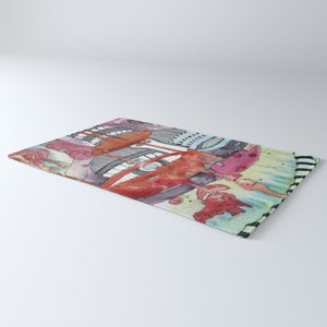 May include: A colorful rug with a whimsical design featuring a red car, a blue bird, and a green tree. The rug has a white and black striped border.