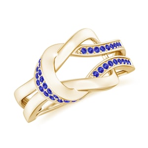 May include: A gold ring with a knot design and blue sapphire stones set in the band.