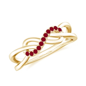 May include: A gold band ring with a delicate, intertwined design. The band is accented with a row of small, red ruby gemstones.