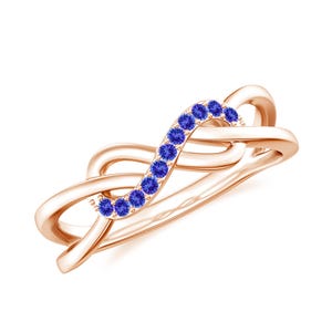 May include: A rose gold ring with a delicate, intertwined design. The ring is accented with a row of small, blue gemstones.