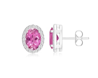 May include: A pair of silver earrings with a pink oval gemstone surrounded by a halo of smaller white gemstones.