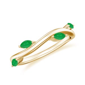 Könnte beinhalten: Ein goldener Bandring mit einem wellenförmigen Design und vier smaragdgrünen, marquiseförmigen Edelsteinen.