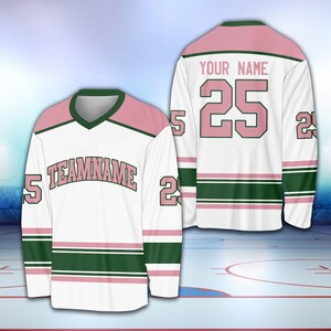 May include: White hockey jersey with pink and green stripes. The jersey has the number 25 on the back and the text "YOUR NAME" above it. The front of the jersey has the text "TEAMNAME" in pink letters.