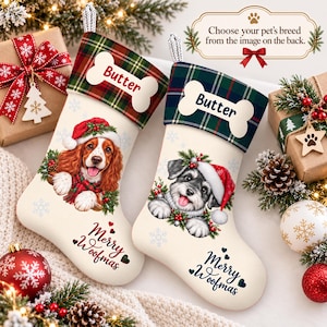 May include: Two cream-colored Christmas stockings featuring a plaid cuff with a bone-shaped tag labeled Butter. One displays a brown spaniel, the other a gray schnauzer, both wearing Santa hats. Text reads Merry Woofmas and Choose your pet's breed.
