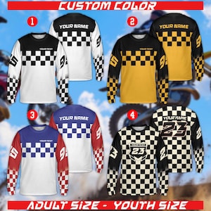 May include: A collection of long-sleeved motocross jerseys in various color combinations. Each jersey features a checkered pattern, personalized text areas, and numbers. The image includes text that reads "CUSTOM COLOR" and "ADULT SIZE - YOUTH SIZE."