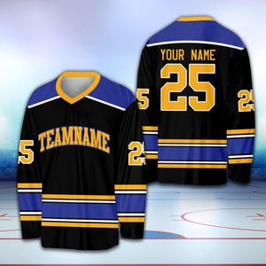 May include: Black hockey jersey with blue and gold stripes. The jersey has the text "TEAMNAME" on the front and the number "25" on the back with the text "YOUR NAME" above it.