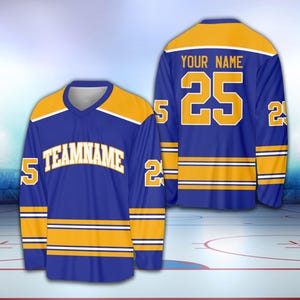 May include: A blue and gold hockey jersey with the number 25 and the text "YOUR NAME" on the back. The front of the jersey has the text "TEAMNAME" and the number 5 on each sleeve.