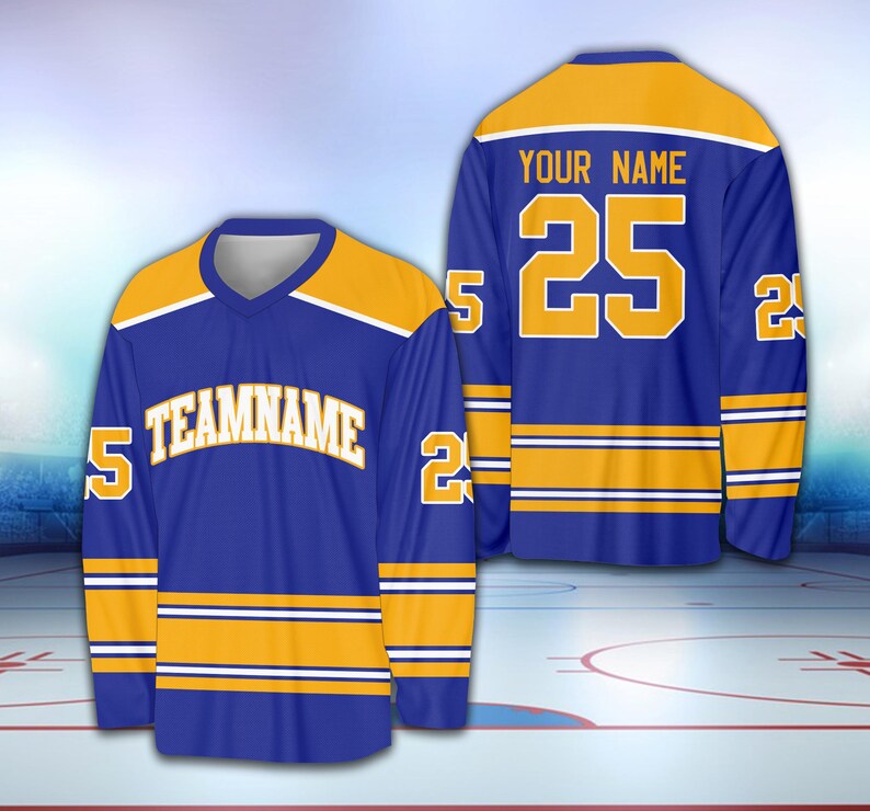 May include: A blue and gold hockey jersey with the number 25 and the text "YOUR NAME" on the back. The front of the jersey has the text "TEAMNAME" and the number 5 on each sleeve.