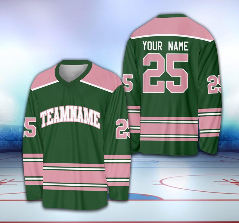 May include: Green and pink hockey jersey with white lettering. The jersey has the text "TEAMNAME" on the front and the number "25" on the back. The text "YOUR NAME" is above the number on the back.