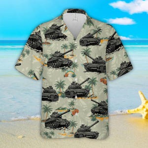 May include: A short-sleeved button-down shirt with a repeating pattern of black tanks, palm trees, and rainbows on a light green background. The shirt has a classic collar and a relaxed fit, perfect for casual wear.
