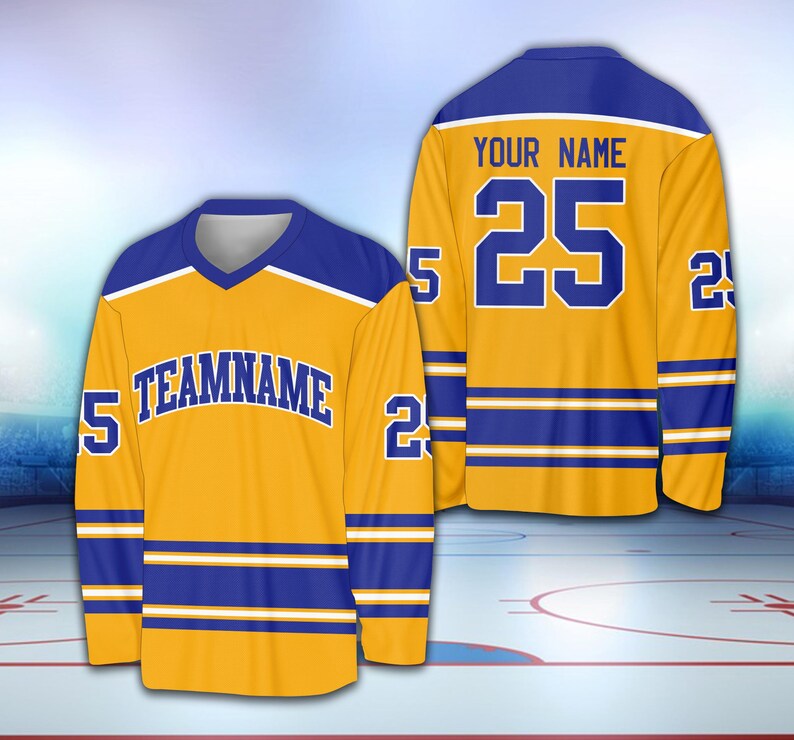 May include: A gold hockey jersey with blue and white stripes. The jersey has the number "25" and the text "YOUR NAME" on the back. The front of the jersey has the text "TEAMNAME" and the number "25" on the sleeves.