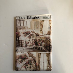 May include: A sewing pattern for a bedspread, curtains, and pillows. The pattern is from Butterick and is number 6370. The pattern features a floral design with a ruffled edge.