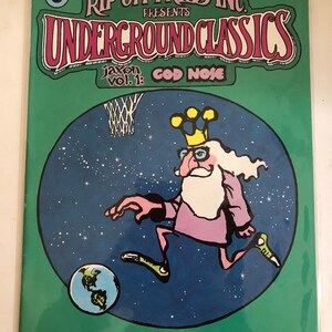 May include: A green comic book cover with the title "Rip Off Press Inc. Presents Underground Classics" and the subtitle "Jaxon Vol. 1: God Nose". The cover features a cartoon illustration of a man with a crown and beard playing basketball with the Earth.